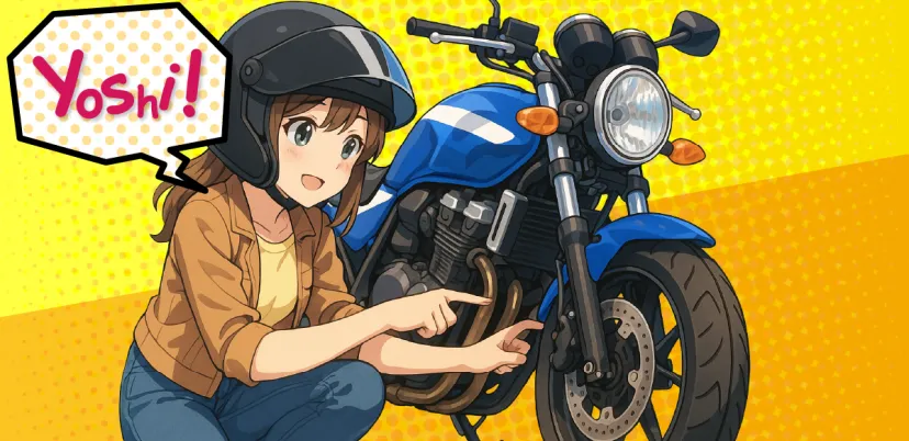 オートバイのタイヤを点検するライダー